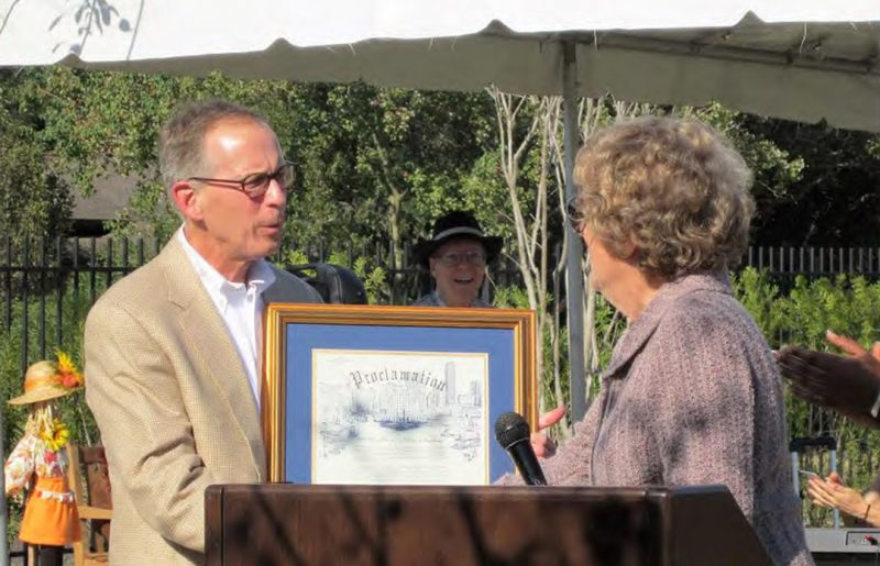 Jim Gray receiving proclamation from city