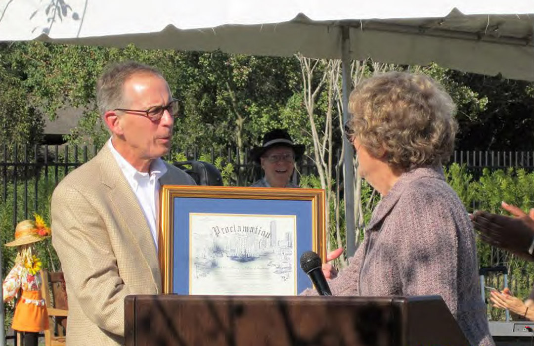 Jim Gray receiving proclamation from city